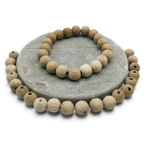 White oak beads in bracelet on the stone decoration and white oak beads loose around